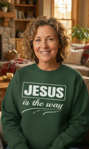 Women wearing green sweatshirt with Jesus is the way text